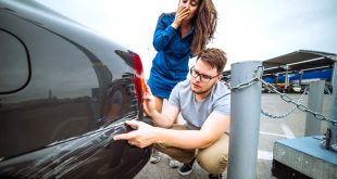 Personal Injury Lawyer Reviews Dans Man with Sad Look On Scratched Car Woman with sorry Look Near D